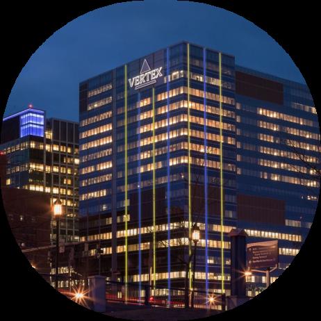 An image of the Vertex headquarters in Boston lit up blue and yellow for CF Awareness Month
