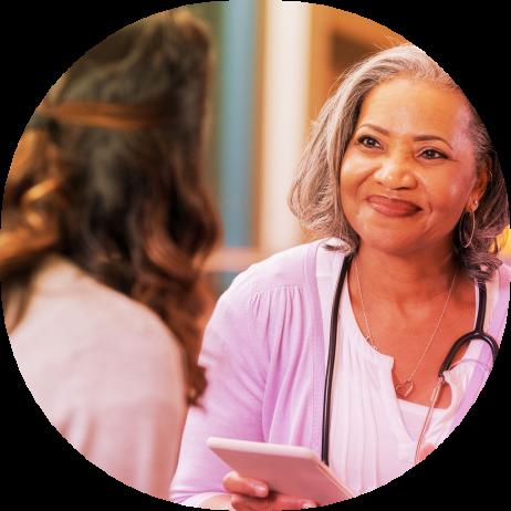 Doctor speaks with patient during clinical trial discussion