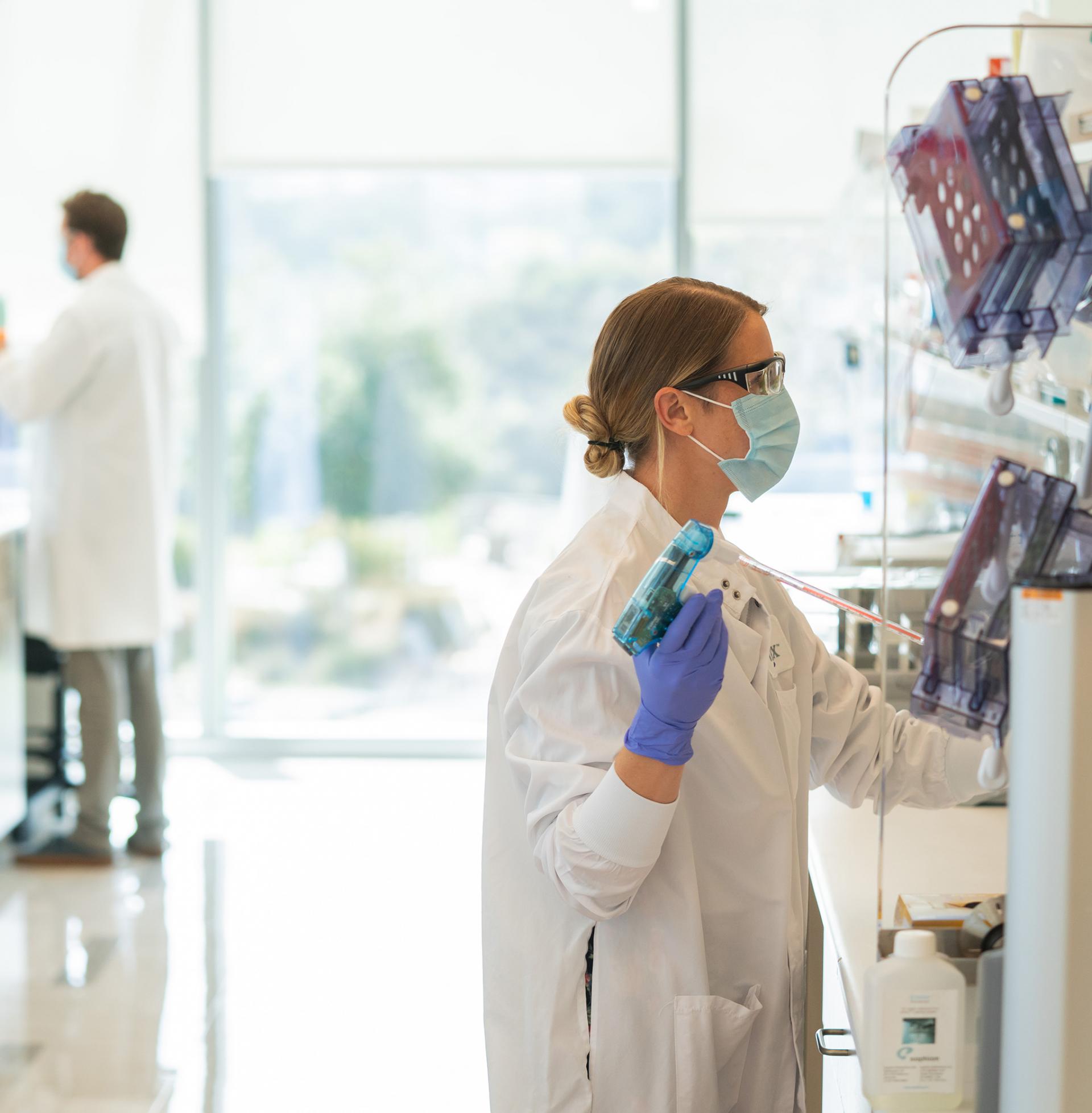 female scientist at fume hood in a Vertex lab