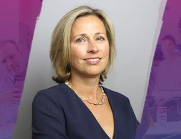 An image of Stephanie Franklin, Chief Human Resource Officer at Vertex Pharmaceuticals, with purple watercolor designs on either side of her