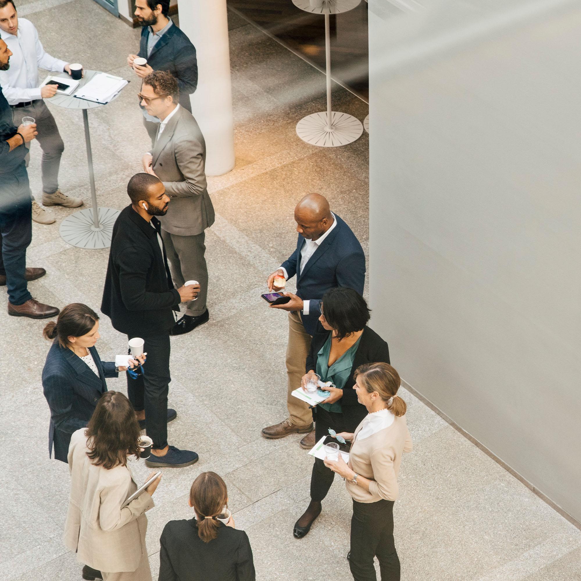 A view from above as businesspeople gather and have conversations