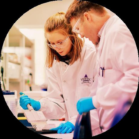 two scientists working at a lab bench