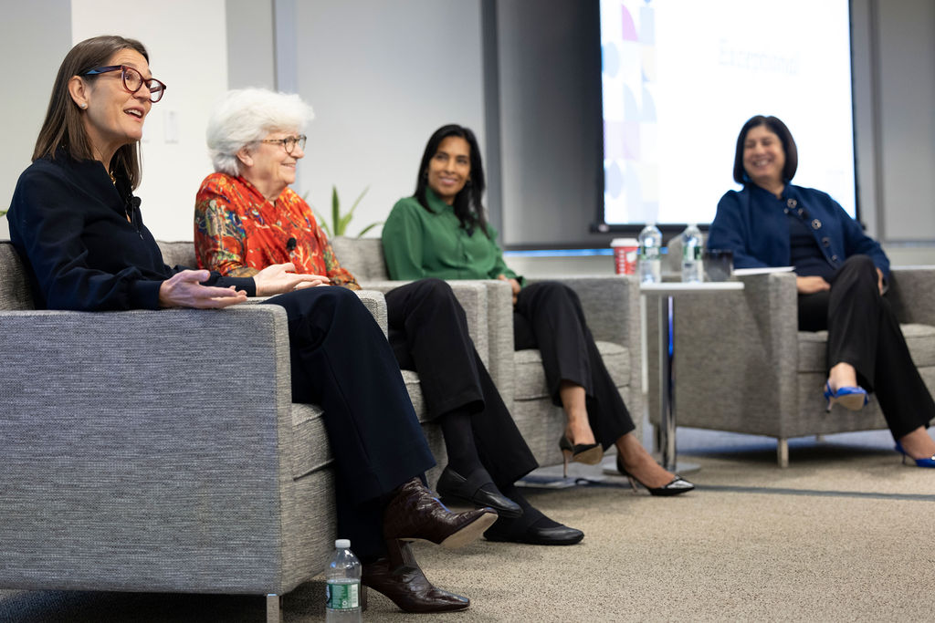 An image of Vertex Pharmaceuticals CEO and President Reshma Kewalramani seated as a speaker at a panel alongside Kate Zernike, Dr. Nancy Hopkins, and Dr. Sangeetq Bhatia.