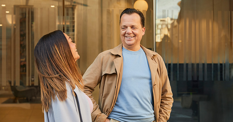 An image of people living with beta thalassemia laughing together while on location in London filming the disease awareness campaign
