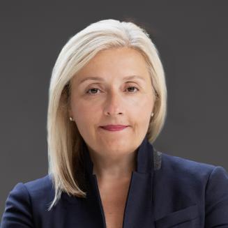 An image of Nia Tatsis, Executive Vice President and Chief Regulatory and Quality Officer at Vertex Pharmaceuticals
