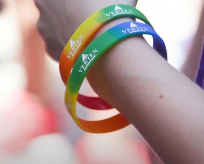 Vertex employees with wristbands at pride parade