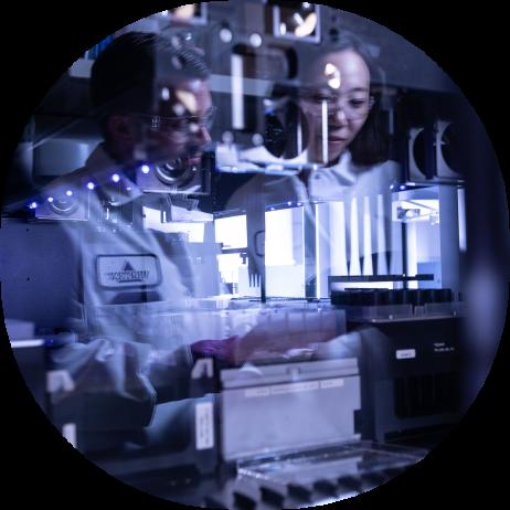 Two Vertex scientists working in the lab 