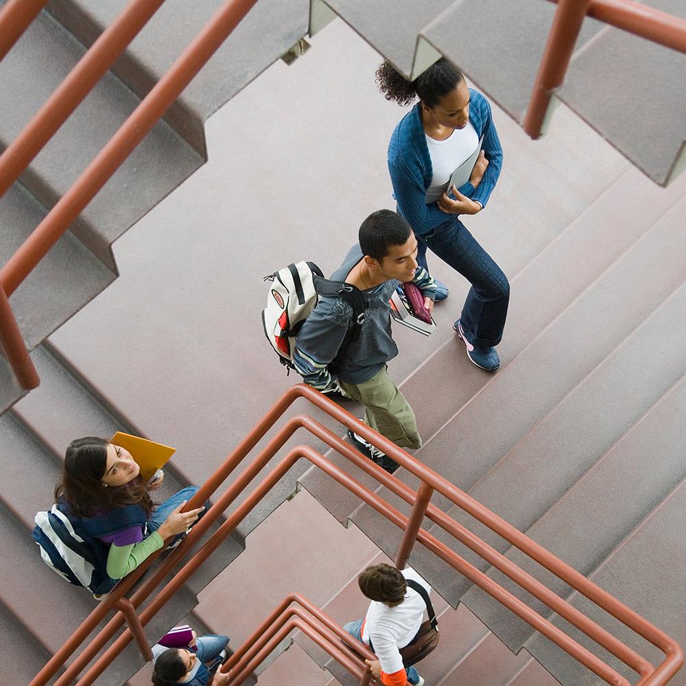 Students walking through stairwell