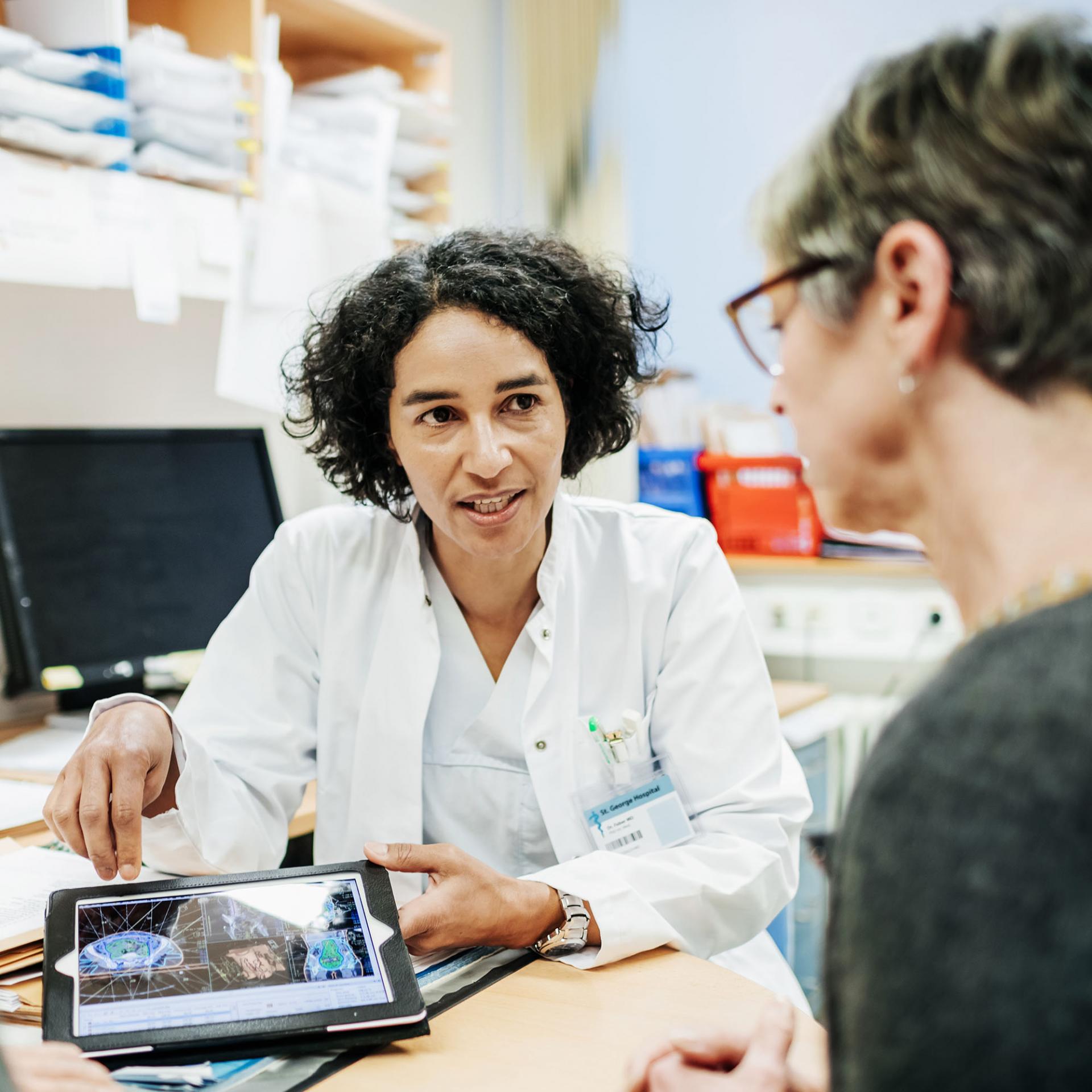 Clinical trial director speaks with patient