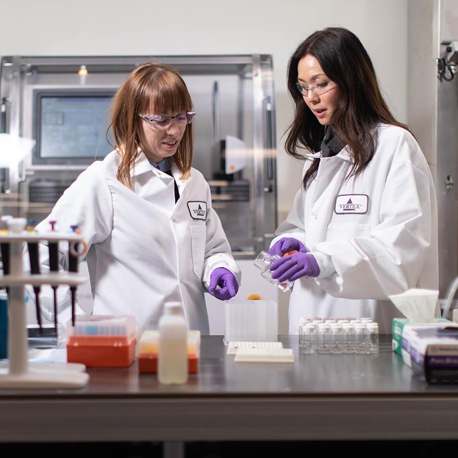 Two female Vertex scientists working in the lab