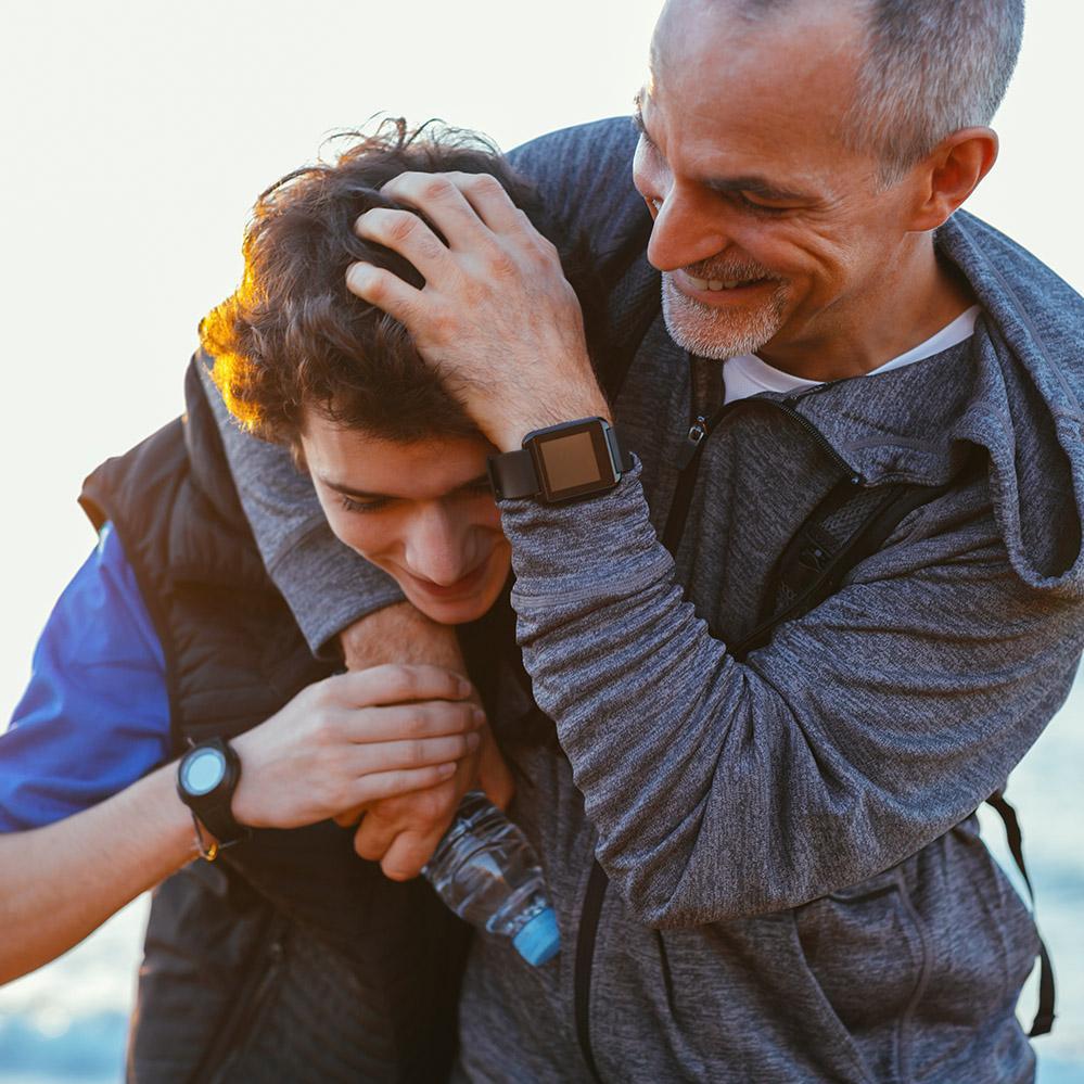 A father and son embracing