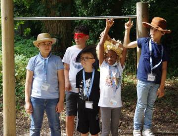An image of a group of children attending the L'ENVOL sibling summer camp