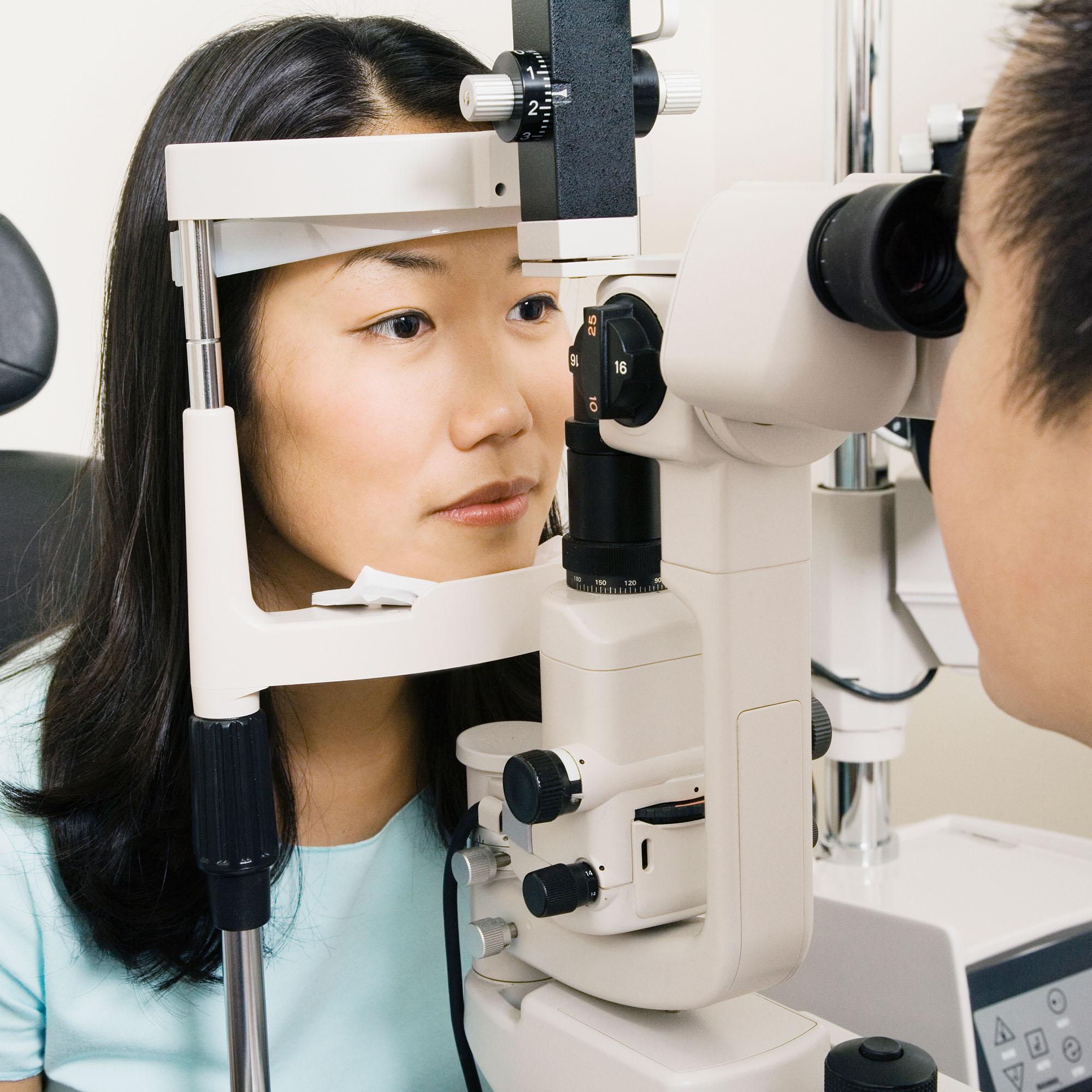 A woman receiving an eye exam