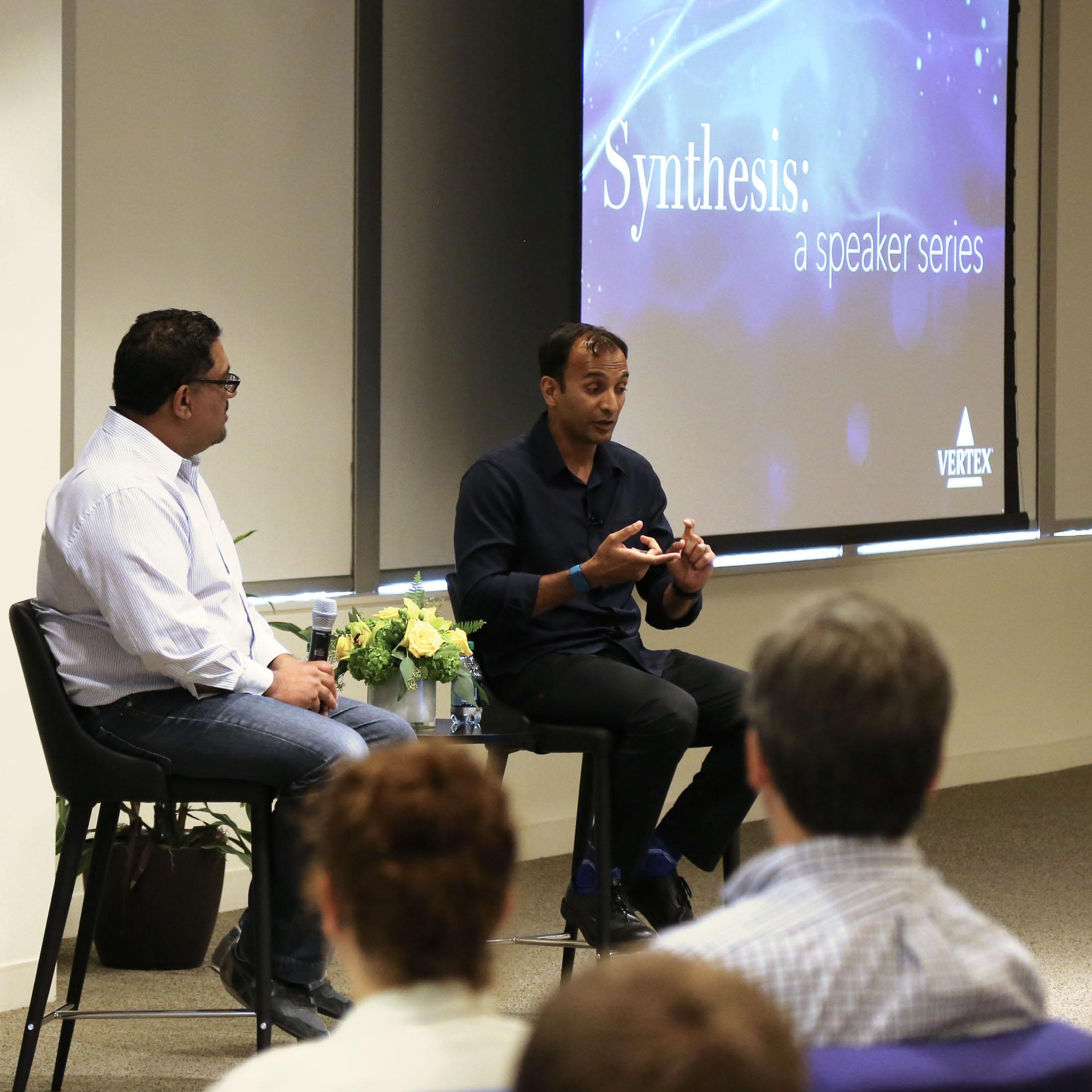 Two speakers on stage during a Vertex seminar