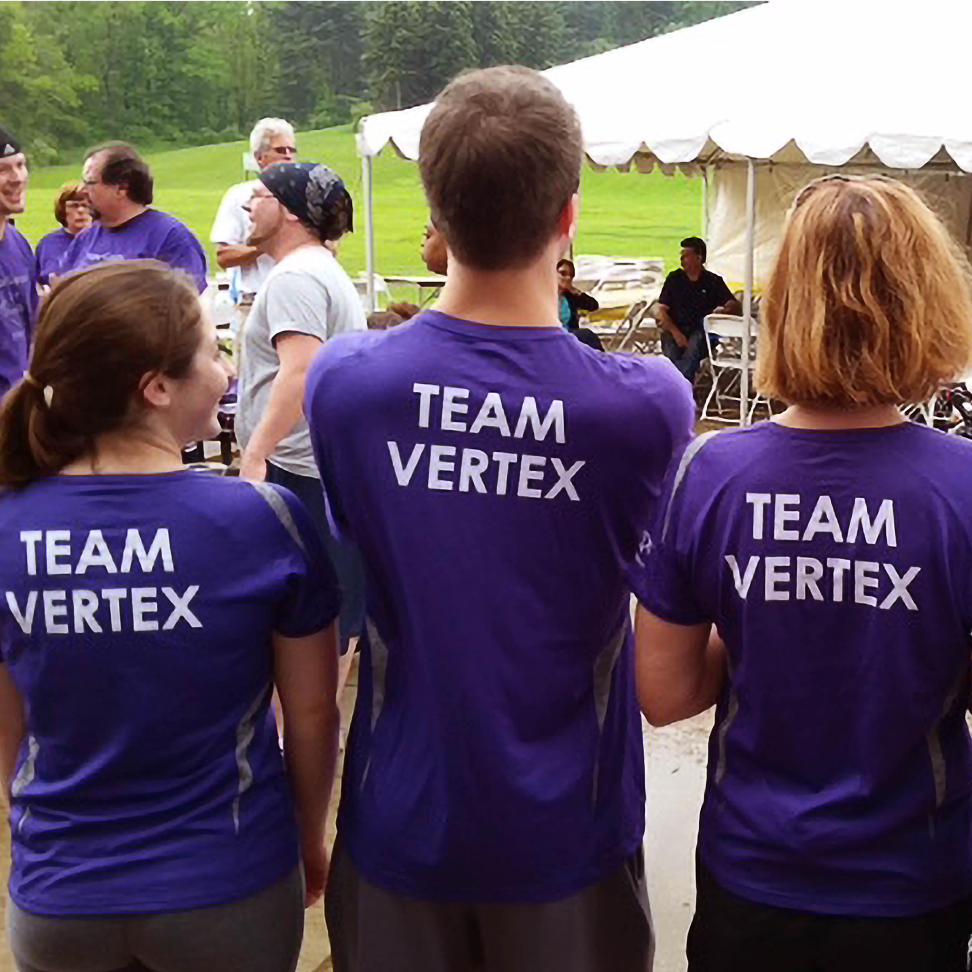 Team Vertex members at a CF event wearing purple shirts