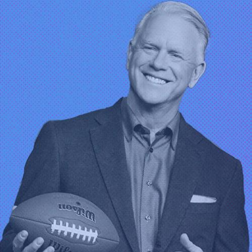 An image of Boomer Esiason holding a football with a blue overlay